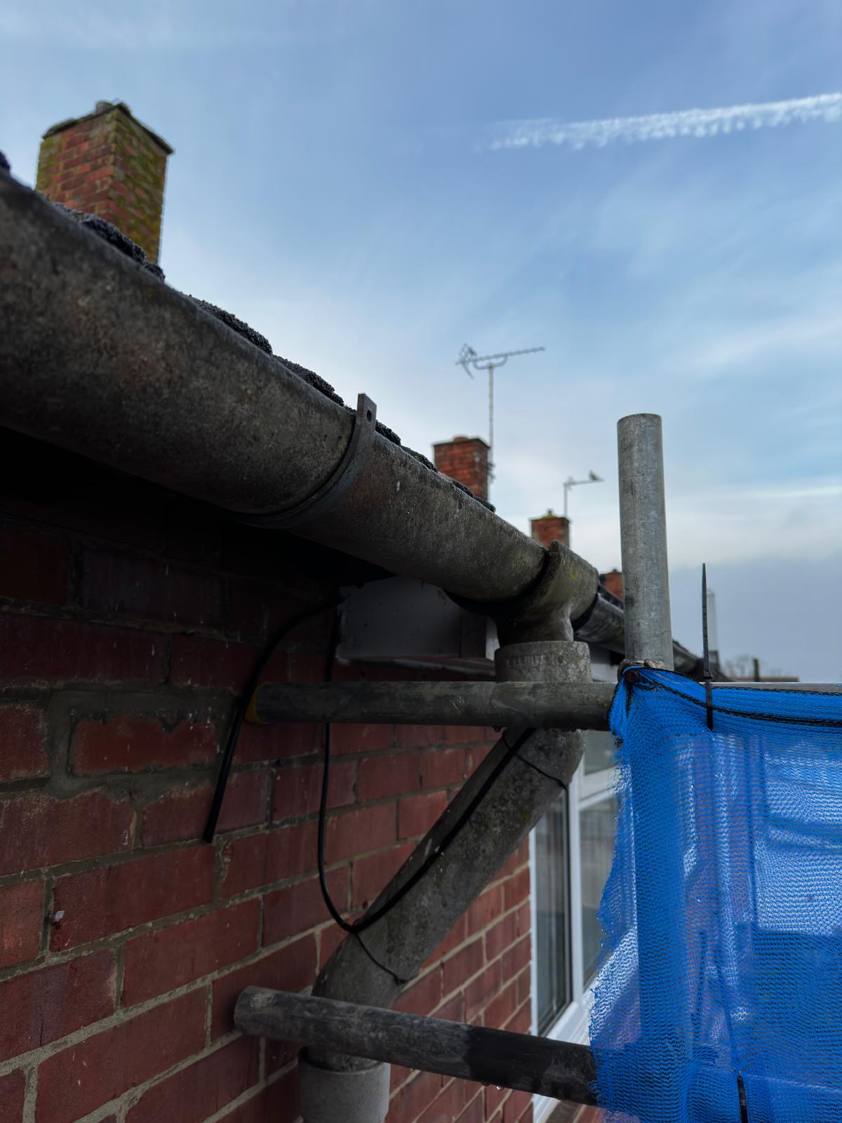 Asbestos cement gutter before removal