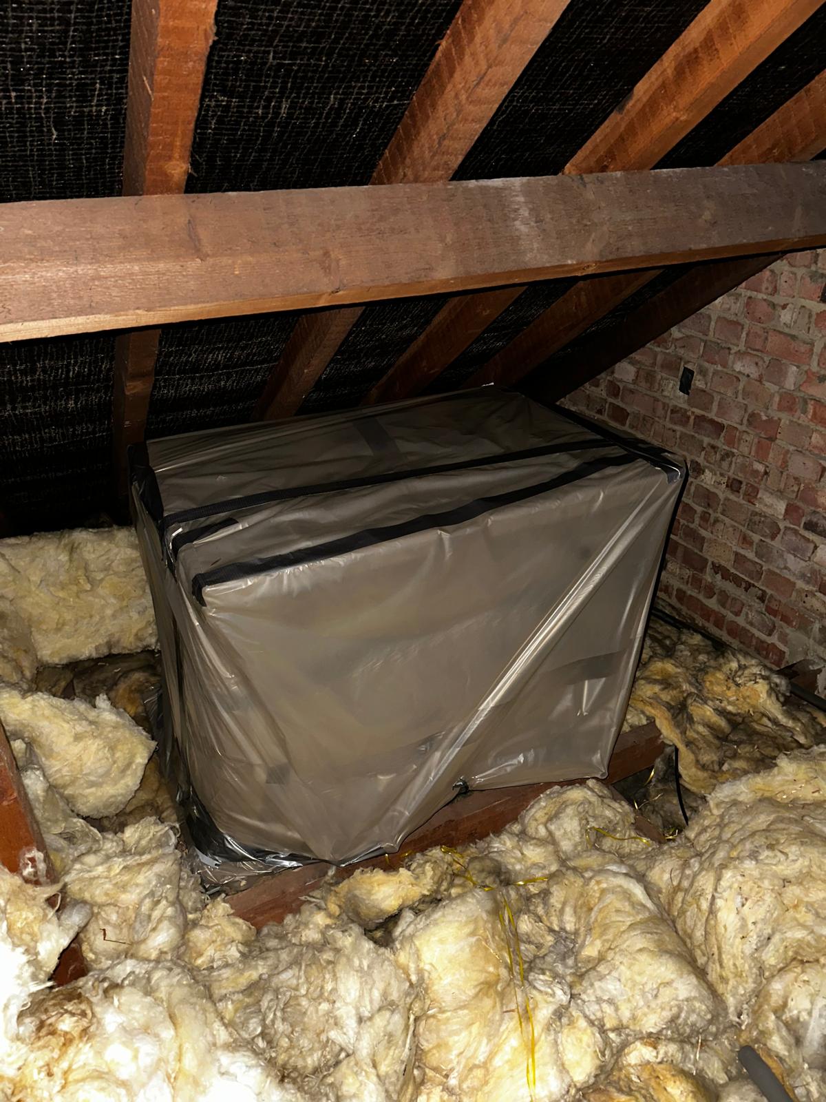 Asbestos water tank contained for removal