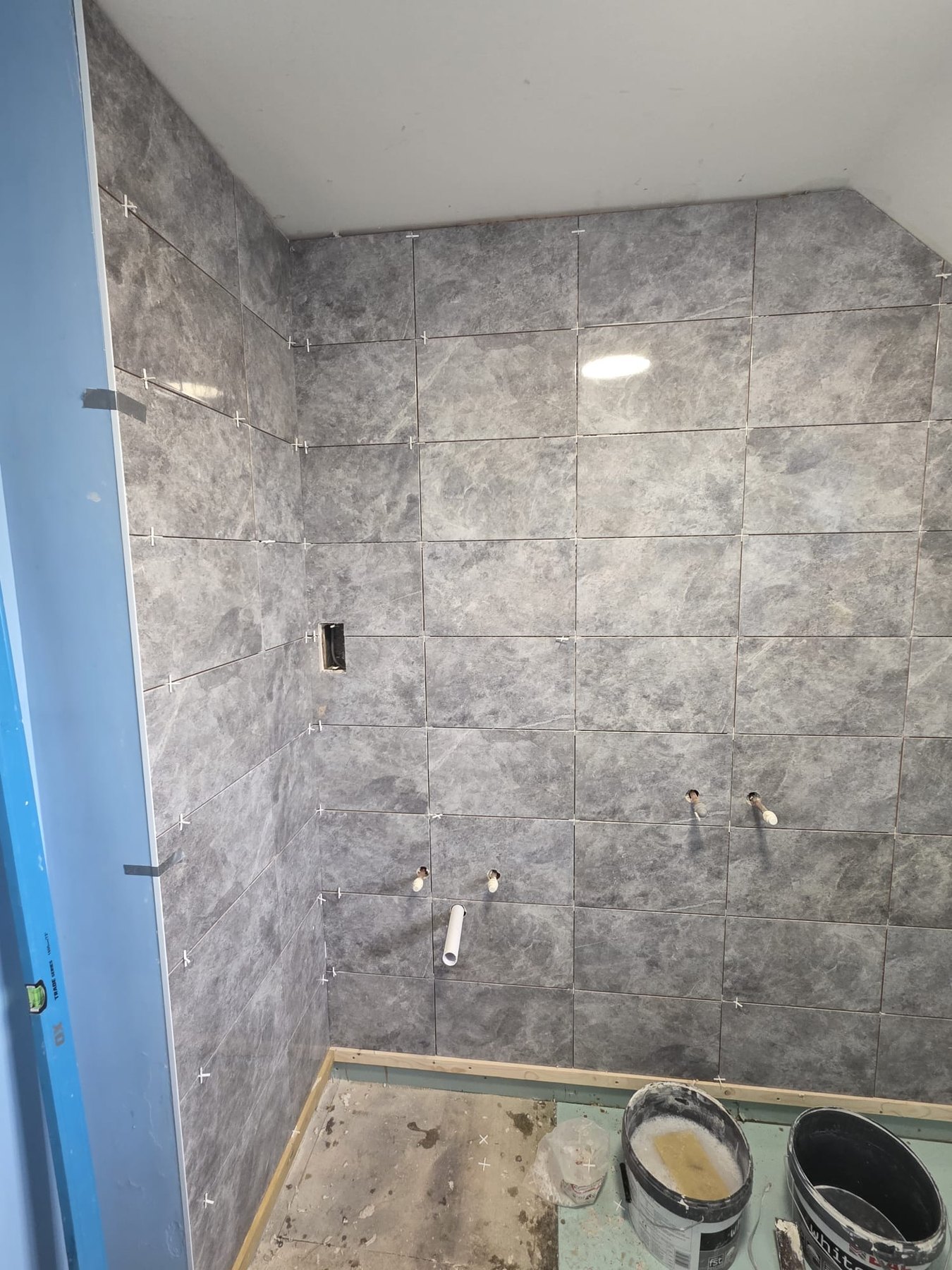 Bathroom tiling in progress